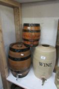 2 oak and a stoneware wine barrels
