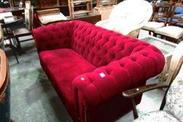 A red plush chesterfield