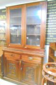 A mahogany glazed top bookcase