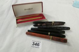 A quantity of fountain pens, some with gold nibs