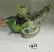 A Faience parrot candlestick signed G.B.V. a/f