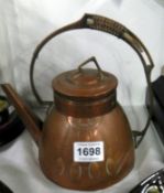 An Arts and Crafts copper coffee pot by Carl Deffner, Esslingen, Germany