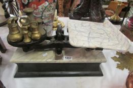 A set of marble top scales with odd weights