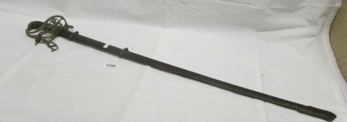 An old sword in scabbard with brass hilt (hilt a/f)