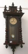 A mahogany Vienna wall clock