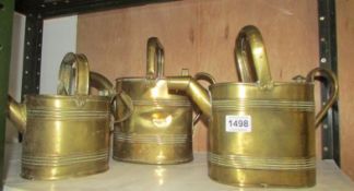 3 brass water cans