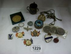 A mixed lot of badges, coins etc