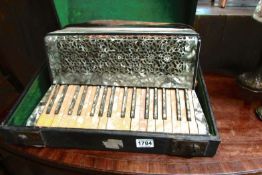 A cased piano accordian