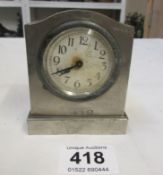 A small metal clock