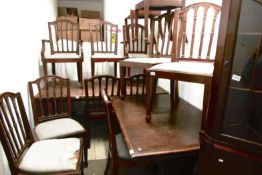 A set of 12 dining chairs comprising 2 carvers and 8 diners