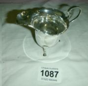 A silver cream jug