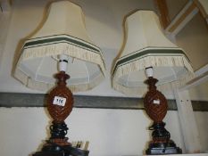 A pair of table lamps with shades