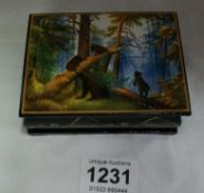 A lacquered box depicting bears in forest