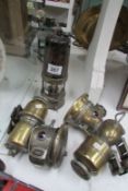 2 brass carbide cycle lamps and a miner's lamp