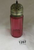 A Cranberry glass sugar sifter