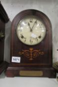 An inlaid mantel clock