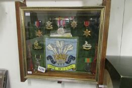 A display case containing medals including TA medal to Private Brook