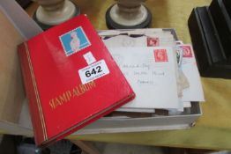 2 stamp albums and loose stamps