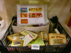 A tray of various match books, match book covers, trade cards etc