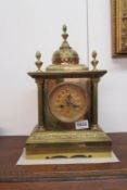 A brass mantel clock