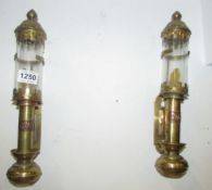 A pair of brass wall mounting candle lamps marked GWR