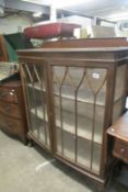 A Victorian mahogany display cabinet on ball and claw feet(1 glass a/f)