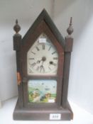 An old mantel clock with rural scene