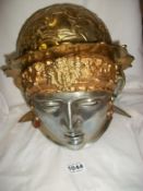 A brass helmet with face plate