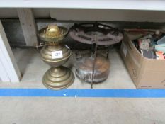 A brass oil lamp base and a spirit stove
