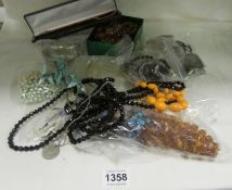 A mixed lot of costume jewellery, necklaces, bangles etc