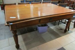 A large library table with drawers in each side