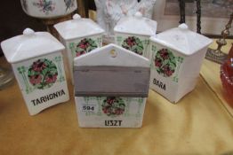 A quantity of Continental storage jars with floral decoration