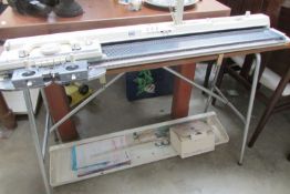 A Brother knitting machine and accessories