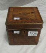 An inlaid mahogany money box