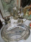 A 3 piece silver plate tea set and a silver plate basket
