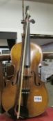 A viola with Stradivarius label and bow marked Erich Steiner