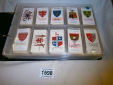 An album of Will's cigarette cards inc. coats of arms, military, nature etc
