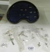 A mixed lot of silver chains, crosses, rings, jewellery pouches etc