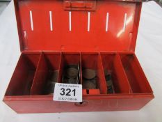 A savings box and coins