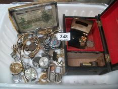 A mixed lot of watches, coins, buckles etc