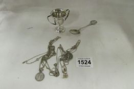 A silver trophy, silver spoon, silver pendants etc