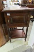 A mahogany cabinet on turned legs