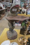 A cast iron 'frog' bird bath