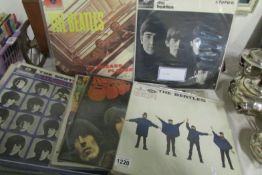 The first 12 Beatles albums, Please Please me, Let it Be etc