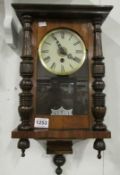 A Victorian mahogany wall clock, missing pediment