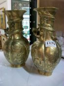 A pair of polished bronze Japanese vases