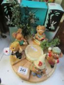 A Pendelfin stand and 5 boxed rabbits