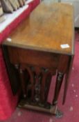 A Victorian Gothic style gate leg table