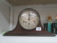 An oak mantel clock