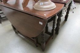 An oak barley twist gate leg table